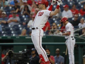 Washington Nationals' Bryce Harper (34) stretches between pitches in at-bat during the first inning of the team's baseball game against the Baltimore Orioles at Nationals Park, Thursday, June 21, 2018, in Washington. Harper was walked on the at-bat.
