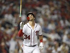 Washington Nationals' Bryce Harper reacts after he grounded out during the seventh inning of a baseball game against the New York Yankees, Monday, June 18, 2018, in Washington. The Yankees won 4-2.