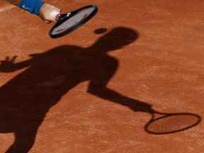 Jared Donaldson, of the U.S, slams a forehand to Bulgaria's Grigor Dimitrov during their second round match of the French Open tennis tournament at the Roland Garros stadium, Wednesday, May 30, 2018 in Paris.