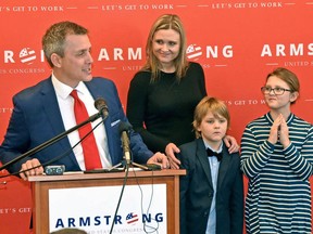 FILE - In this Feb. 22, 2018, file photo, North Dakota Republican Party Chairman and state Sen. Kelly Armstrong, left, kicks off his campaign to seek the GOP nomination for the U.S. House in Bismarck, N.D. He is running to fill the seat being vacated by U.S. Rep. Kevin Cramer. Looking on are his wife Kjersti, son Eli, and daughter Anna. The Republican primary is Tuesday, June 12, 2018.