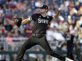 Mississippi State pitcher Ethan Small works against Oregon State in the first inning of an NCAA College World Series baseball elimination game in Omaha, Neb., Saturday, June 23, 2018.