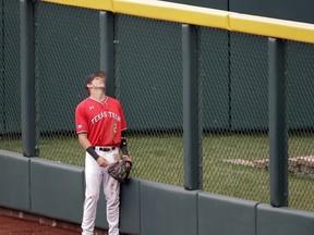 Texas Tech right fielder Gabe Holt (2) watches the solo home run ball hit by Arkansas' Jared Gates sail over the fence in the second inning of an NCAA College World Series baseball game in Omaha, Neb., Wednesday, June 20, 2018.