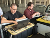 Capital Gazette reporter Chase Cook, right, and photographer Joshua McKerrow work on Friday’s newspaper while awaiting news from their colleagues in Annapolis, Maryland, June 28, 2018.