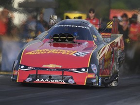 In this photo provided by the NHRA, Courtney Force drives in Funny Car qualifying at the Virginia NHRA Nationals drag races at Virginia Motorsports Park in Dinwiddie, Va., Friday, June 8, 2018. Force took the provisional top spot with a run of 3.983 seconds at 323.35 mph.