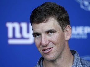 New York Giants quarterback Eli Manning talks to reporters during the team's NFL football organized activities, Tuesday, June 12, 2018, in East Rutherford, N.J.