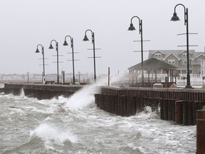 This March 2, 2018 file photo shows high Winds and rough surf pound the bulkhead  in Stone Harbor, N.J. A new report finds that high-tide flooding is happening across the United States at twice the rate it was just 30 years ago, and predicts records for such flooding will continue to be broken for decades as sea levels rise.  The National Oceanographic and Atmospheric Administration said high tide flooding, sometimes called sunny-day or "nuisance flooding," tied or set records last year in more than a quarter of the 98 places the agency monitors around the country.