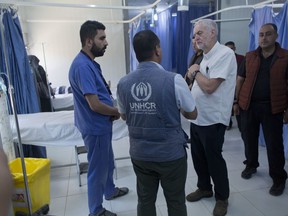 United Kingdom's Labour party leader Jeremy Corbyn inspects a primary health care center during his visit to the Zaatari Syrian Refugee Camp, in Mafraq, Jordan, Friday, June 22, 2018.