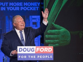 Ontario PC leader Doug Ford looks up and acknowledges his late brother Rob Ford after winning the Ontario Provincial election to become the new premier in Toronto, on Thursday, June 7, 2018.