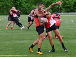 Toronto Wolfpack players practice at Cherry Beach in Toronto on Tuesday, June 5, 2018. The Toronto Wolfpack are settling into their home away from home after an extended schedule in England. First up at newly renovated Lamport Stadium on Saturday are the London Broncos, the only team to beat rugby league's first transatlantic team, in league play this season.