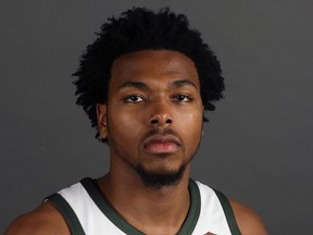 FILE - In this Sept. 25, 2017, file photo, Milwaukee Bucks' Sterling Brown poses for photos during NBA basketball team media day in Milwaukee. Newly released police videos showing the stun gun arrest of Bucks guard Sterling Brown show one officer stepping on Brown's ankle while he was handcuffed on the ground and others discussing the potential backlash of taking down an African American professional basketball player. Brown was arrested for a parking violation in Milwaukee in January.