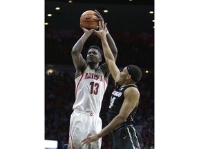 FILE - In this Jan. 25, 2018, file photo, Arizona forward Deandre Ayton (13)shoots in the second half during an NCAA college basketball game against Colorado, in Tucson, Ariz. Ayton was a force in his lone college season and looks like the favorite to land with Phoenix as the No. 1 overall pick in Thursday's NBA Draft.