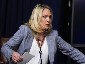 FILE - In this March 22, 2018, file photo, Kelly Sadler, special assistant to President Donald Trump, attends a forum at the Eisenhower Executive Office Building on the White House complex in Washington. Sadler, who was dismissive of gravely ill Sen. John McCain during a closed-door meeting last month, has left the White House. White House spokesman Raj Shah says, "Kelly Sadler is no longer employed within the Executive Office of the President."