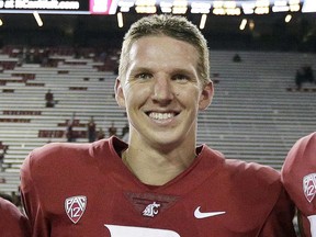 FILE - In this Sept. 9, 2017, file photo, Washington State quarterback Tyler Hilinski poses for a photo after an NCAA college football game against Boise State in Pullman, Wash. The family of the Washington State University football player who died of suicide in January said the 21-year-old quarterback had extensive brain damage that's been linked to concussions from playing the sport. Tyler Hilinski was found dead in his apartment with a gunshot wound and a suicide note on Jan. 16. Mark and Kym Hilinski told NBC's "Today" show on Tuesday, June 26, 2018, that the Mayo Clinic did an autopsy of their son's brain.