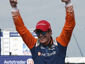 FILE - In this June 2, 2018, file photo, Scott Dixon, of New Zealand, celebrates after winning the first race of the IndyCar Detroit Grand Prix auto racing doubleheader, in Detroit. Dixon is on a roll with four top-5 finishes, including a win last week at Belle Isle, over the last four races. That victory tied Dixon for third on the career victory list, with a stop at Fort Worth coming up this weekend.