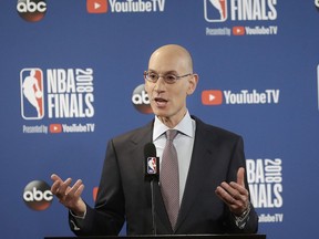 FILE - In this May 31, 2018, file photo, NBA Commissioner Adam Silver speaks at a news conference before Game 1 of basketball's NBA Finals between the Golden State Warriors and the Cleveland Cavaliers, in Oakland, Calif. A diversity report released shows the NBA continues to lead the way in men's professional sports in racial and gender hiring practices. The league earned an A+ for racial hiring practices and a B for gender hiring practices for an overall grade of an A.