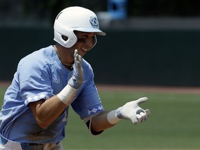 FILe - In this June 8, 2018, file photo, North Carolina's Cody Roberts reacts following his homer against Stetson during the fifth inning of an NCAA super regional college baseball game in Chapel Hill, N.C. North Carolina's offense is rolling along as the Tar Heels return to the College World Series for the first time since 2013.