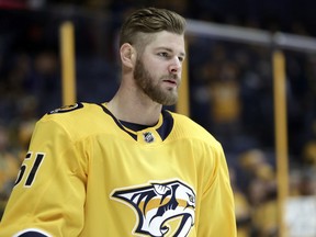 FILE - In this Jan. 21, 2018, file photo, Nashville Predators left wing Austin Watson warms up before an NHL hockey game against the Florida Panthers, in Nashville, Tenn. Police in Tennessee have arrested Nashville Predators forward Austin Watson on a charge of domestic assault. Franklin Police Lt. Charles Warner said Watson was arrested Saturday evening, June 16, 2018.