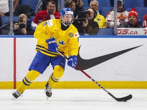 FILE - In this Dec. 31, 2017, file photo, Sweden's Rasmus Dahlin skates during the second period of an IIHF world junior hockey championships game against Russia in Buffalo, N.Y. At 6-foot-2 and 181 pounds, Dahlin is considered the most NHL-ready prospect in this year's draft class for his all-around ability. He's already drawing comparisons to other elite Swedish defensemen such as former Detroit star and seven-time Norris Trophy-winner Nicklas Lidstrom and Ottawa captain and two-time Norris winner Erik Karlsson.