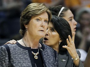 FILE - In this March 19, 2011, file photo, Tennessee head coach Pat Summitt, left, listens to assistant coach Mickie DeMoss in the first half of a first round game between Tennessee and Stetson in the NCAA college basketball tournament, in Knoxville, Tenn. Connecticut assistant coach Chris Dailey  and former Tennessee assistant Mickie DeMoss are breaking new ground this weekend when they get inducted into the Women's Basketball Hall of Fame. This marks the first time in the organization's 20-year history that it has inducted anyone based on accomplishments as an assistant coach.