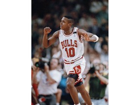 FILE - In this May 7, 1992, file photo, Chicago Bulls' B.J. Armstrong reacts after hitting a basket late in the fourth quarter to help the Bulls defeat the New York Knicks 86-76 at Chicago Stadium in Chicago. "Greatness is empowered in a system where you pass the ball, not pound it," Armstrong says. "Everyone has to be committed to this system. The best player on the team has to realize that he needs the team in order to win."