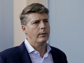 FILE - In this Nov. 15, 2017, file photo, Hal Steinbrenner, general managing partner of the New York Yankees, talks with reporters at the annual MLB baseball general managers' meetings in Orlando, Fla. Steinbrenner says the Yankees may need a starting pitching upgrade if they're going to reach their first World Series since 2009. Steinbrenner said Wednesday, June 13, the club will explore the trade market for an arm, especially considering the recent loss of left-hander Jordan Montgomery, who had season-ending Tommy John surgery on June 7.