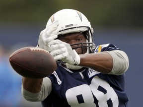 FILE - In this May 29, 2018, file photo, Los Angeles Chargers' Virgil Green can't make the catch during the NFL football team's practice in Costa Mesa, Calif. In his first season with the Chargers, the veteran tight end's unselfishness might be exactly what is needed following the loss of emerging star Hunter Henry to a serious knee injury. "This isn't the first time something like this has happened, and it's always 'next man up' mentality," Green said following the first day of mandatory minicamp Tuesday, June 12. "Everybody in that room has to contribute, whether you are No. 1 on the depth chart or last on the depth chart."