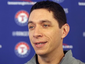 FILE - In this Feb. 15, 2018, file photo, Texas Rangers general manager Jon Daniels speaks to reporters during a baseball spring training workout in Surprise, Ariz. The Rangers have given general manager Jon Daniels a multiyear contract extension. While there were no other details revealed Thursday, June 7, 2018, the new deal adds to Daniels' contract that went only through this season.