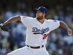 FILE - In this May 31, 2018, file photo, Los Angeles Dodgers starting pitcher Clayton Kershaw throws to a Philadelphia Phillies batter during the third inning of a baseball game in Los Angeles. Kershaw is scheduled make a minor-league rehab start on Saturday as he continues his recovery from a strained lower back. The three-time NL Cy Young Award could be back pitching in the majors soon.