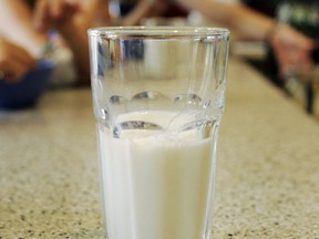 FILE - This June 8, 2007 file photo shows a glass of milk on a table during a family breakfast in Montgomery, Ala. Nearly 20 years ago, about nearly half of high school students said they drank at least one glass of milk a day. But now it's down to less than a third, according to a survey released by the Centers for Disease Control and Prevention on Thursday, June 14, 2018.