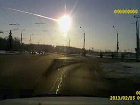 In this Feb. 15, 2013 image made from a dashboard camera video, a meteor streaks through the sky over Chelyabinsk, Russia.