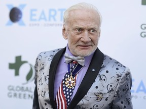 FILE - In this Feb. 28, 2018, file photo, Buzz Aldrin attends the 15th annual Global Green Pre-Oscar Gala, at NeueHouse Hollywood in Los Angeles. Aldrin is suing two of his children and a business manager, accusing them of misusing his credit cards, transferring money from an account and slandering him by saying he has dementia.