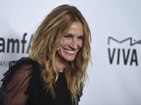 FILE - In this  Oct. 13, 2017, file photo, Julia Roberts attends the 2017 amfAR Inspiration Gala Los Angeles in Beverly Hills, Calif. The "Pretty Woman" star has joined Instagram, posting a photo of herself sitting on the grass in denim shorts and a black top that says "love." She captioned the photo, "Hello."