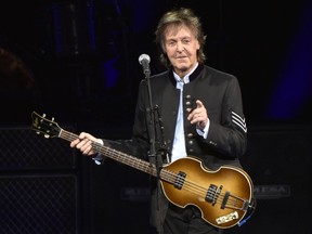 FILE - In this July 26, 2017, file photo, Paul McCartney performs on the One on One Tour at the Hollywood Casino Amphitheatre in Tinley Park, Ill. It was a magical mystery tour as McCartney led James Corden through his hometown during a "Carpool Karaoke" segment on CBS' "Late Late Show." The program on Thursday, June 21, 2018, wrapped up a weeklong stay in London and the Beatles legend joined Corden for a drive around Liverpool.