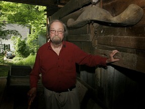 FILE - In this June 13, 2006, file photo, Donald Hall, author of numerous poetry books, poses in the barn of the 200-year-old Wilmot farm that has been in his family for four generations. Hall, a prolific, award-winning poet and man of letters widely admired for his sharp humor and painful candor about nature, mortality, baseball and the distant past, died at age 89. Hall's daughter, Philippa Smith, confirmed Sunday, June 24, 2018, that her father died Saturday at his home in Wilmot, after being in hospice care for some time.