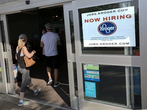 In this June 1, 2018, photo, a hiring sign hangs in front of a Kroger's grocery store in Hilton Head, S.C. On Tuesday, June 5, the Labor Department reports on job openings and labor turnover for April.