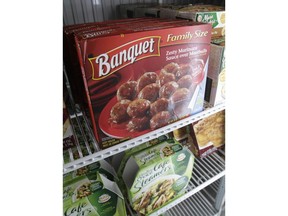 FILE- In this May 19, 2011, file photo Banquet frozen meatballs are displayed in a Little Rock, Ark., food warehouse. ConAgra, which owns Banquet and Healthy Choice, said Wednesday, June 27, 2018, that it is buying Pinnacle Foods for about $10.9 billion, citing in part the potential to capitalize on the recent resurgence of frozen food sales.