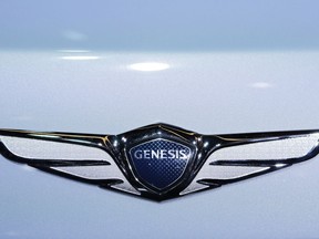 FILE- In this March 24, 2016, file photo, the emblem for the Genesis New York Concept is displayed at the New York International Auto Show. The annual survey by J.D. Power finds that buyers reported a record-low 93 problems per 100 vehicles during the first three months of ownership, four problems fewer than last year. The survey also found that Korean brands Genesis, Kia and Hyundai claimed the top three spots for the first time in new vehicle quality.