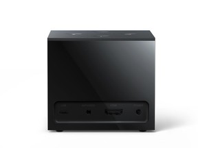 This undated image provided by Amazon.com, Inc. shows an Amazon Fire TV Cube. Amazon unveiled the new voice-controlled Fire TV device, which lets users shout out when they want to turn on the TV, flip channels or search for sitcoms, all without pushing any buttons. The Fire TV Cube is not entirely hands-free yet, however. Some apps or streaming services may require viewers to pick up the included remote to rewind or stop a show. (Amazon.com, Inc. via AP)