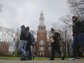 FILE - In this Feb. 1, 2017, file photo, Brooklyn College students walk between classes on campus in New York. More than two-thirds of college students at all levels said in a survey that they feel stressed about their personal finances, according The Study on Collegiate Financial Wellness, a 2017 report by The Ohio State University.