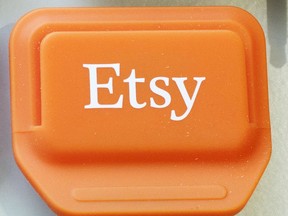 FILE - This Jan. 6, 2015 file photo shows an Etsy mobile credit card reader, in New York. Etsy's stock soared in early trading on Thursday, June 14, 2018, as the online crafts marketplace announced that it's increasing its transaction fee and boosted its full-year revenue outlook.