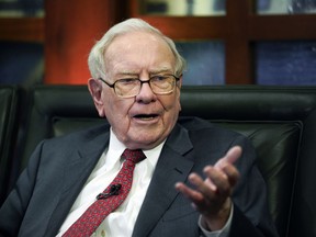 FILE - In this May 7, 2018 file photo, Berkshire Hathaway Chairman and CEO Warren Buffett speaks during an interview in Omaha, Neb. The price of a private lunch with Buffett could set another record this year because the bidding is already over $3 million. The online auction that raises money for the Glide Foundation's work to help the homeless in San Francisco wraps up Friday night, June 1, 2018.