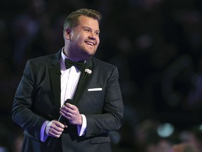 FILE - In this Jan. 28, 2018 file photo, James Corden hosts at the 60th annual Grammy Awards at Madison Square Garden in New York. Corden brings a gleeful buoyancy to his CBS late-night show. That's the case whether he's bantering with all his guests at once or singing duets with stars as he drives.