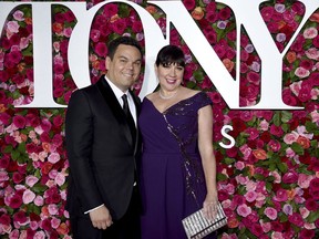 Robert Lopez, left, and Kristen Anderson-Lopez arrive at the 72nd annual Tony Awards at Radio City Music Hall on Sunday, June 10, 2018, in New York.