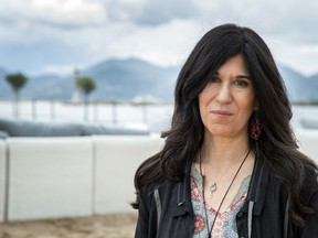 FILE - In this May 14, 2018 file photo, director Debra Granik poses for portrait photographs for the film "Leave No Trace," at the 71st international film festival, Cannes, southern France. The film, starring Ben Foster and Thomasin McKenzie, opens Friday.