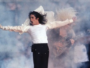 FILE - This Feb. 1, 1993 file photo shows Pop superstar Michael Jackson performing during the halftime show at the Super Bowl in Pasadena, Calif.  A musical about the King of Pop is moonwalking to Broadway. The Michael Jackson Estate and Columbia Live Stage are unveiling plans for a stage musical inspired by the life of Michael Jackson. They hope it will be ready for Broadway by 2020.