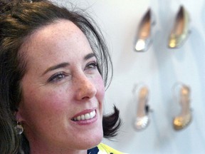FILE - In this May 13, 2004 file photo, designer Kate Spade poses with shoes from her next collection in New York. Law enforcement officials say Tuesday, June 5, 2018, that New York fashion designer Kate Spade has been found dead in her apartment in an apparent suicide.