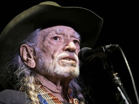 FILE - In this Jan. 7, 2017, file photo, Willie Nelson performs in Nashville, Tenn. Nelson has called out current immigration policies as "outrageous" and extended an offer to meet President Donald Trump at one of the detention centers at the U.S.-Mexico border.