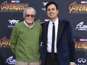 FILE - In this April 23, 2018 file photo, Stan Lee, left, and Keya Morgan arrive at the world premiere of "Avengers: Infinity War" in Los Angeles. Lee has taken out a restraining order against Morgan who had been acting as his business manager and close adviser. Lee took out the order Wednesday, two days after Morgan was arrested on suspicion of filing a false police report.