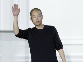 FILE - In this Feb. 13, 2015 file photo, designer Jason Wu acknowledges audience applause after his Fall 2015 collection was modeled during Fashion Week, in New York. The packaging for his namesake eau de parfum was nominated for a Fragrance Foundation Award.