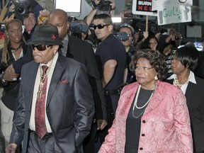 FILE - In this Nov. 7, 2011 file photo, Michael Jackson's parents Joe and Katherine Jackson arrive at the Criminal Justice Center in downtown Los Angeles, after it was announced that jurors had reached a verdict in the involuntary manslaughter trial of Dr. Conrad Murray, Michael Jackson's physician when the pop star died in 2009.  Joe Jackson, the patriarch of America's most famous musical clan has died, says a family source on Wednesday, June 27. He was 89.